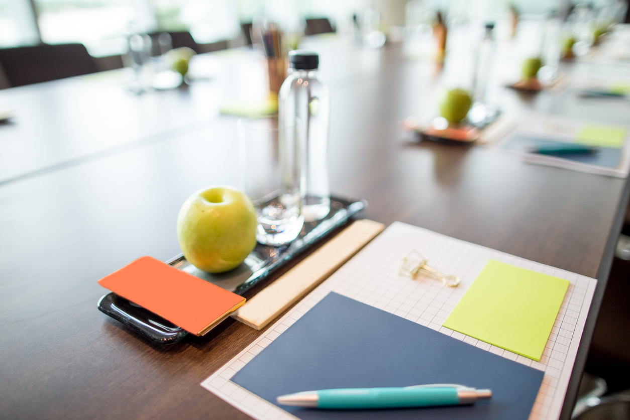Closeup of glass, apple and stationery set on conference table at the Durrant House Hotel in Bideford
